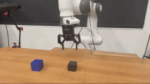 Block stacking policy on a research arm